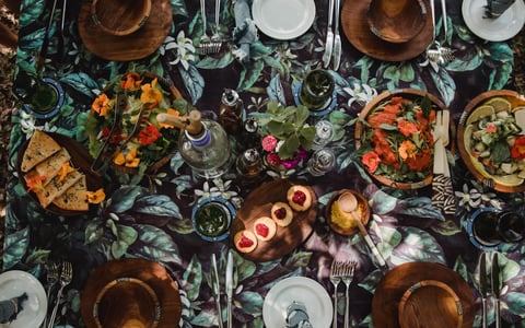 A table is laid out with food and lights.
