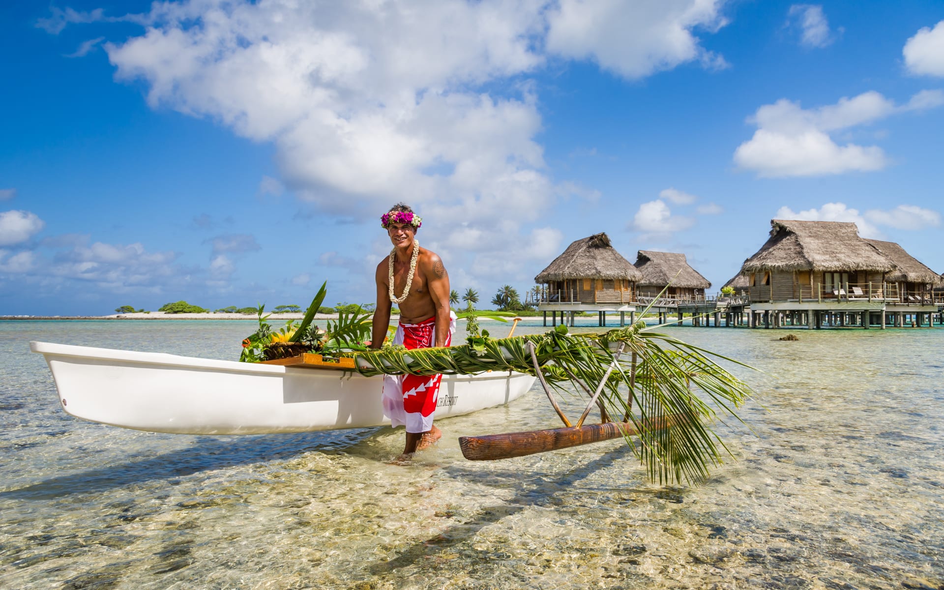 Local Tahitian man was canoeing for food delivery in Tikehau island resort in French Polynesia.