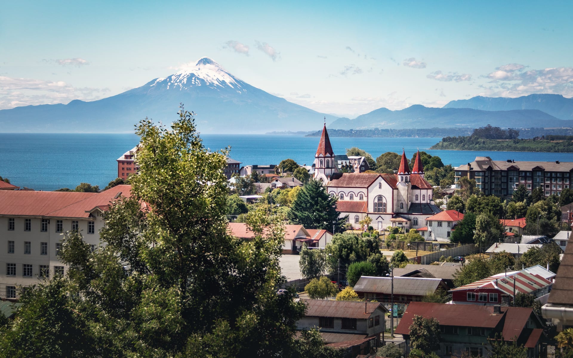 Aerial view of Puerto Varas with Sacred Heart Church and Osorno Volcano.
