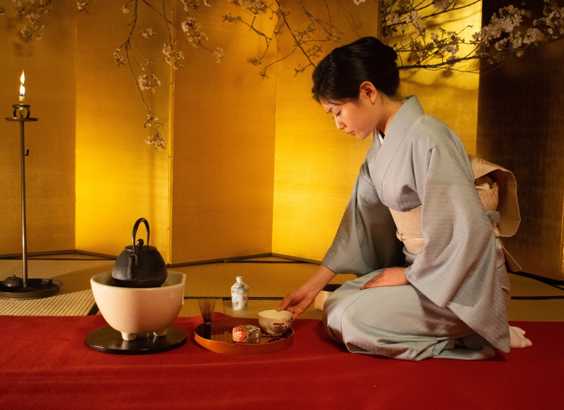 A woman is partaking in a Tea Ceremony in Kyoto, Japan.