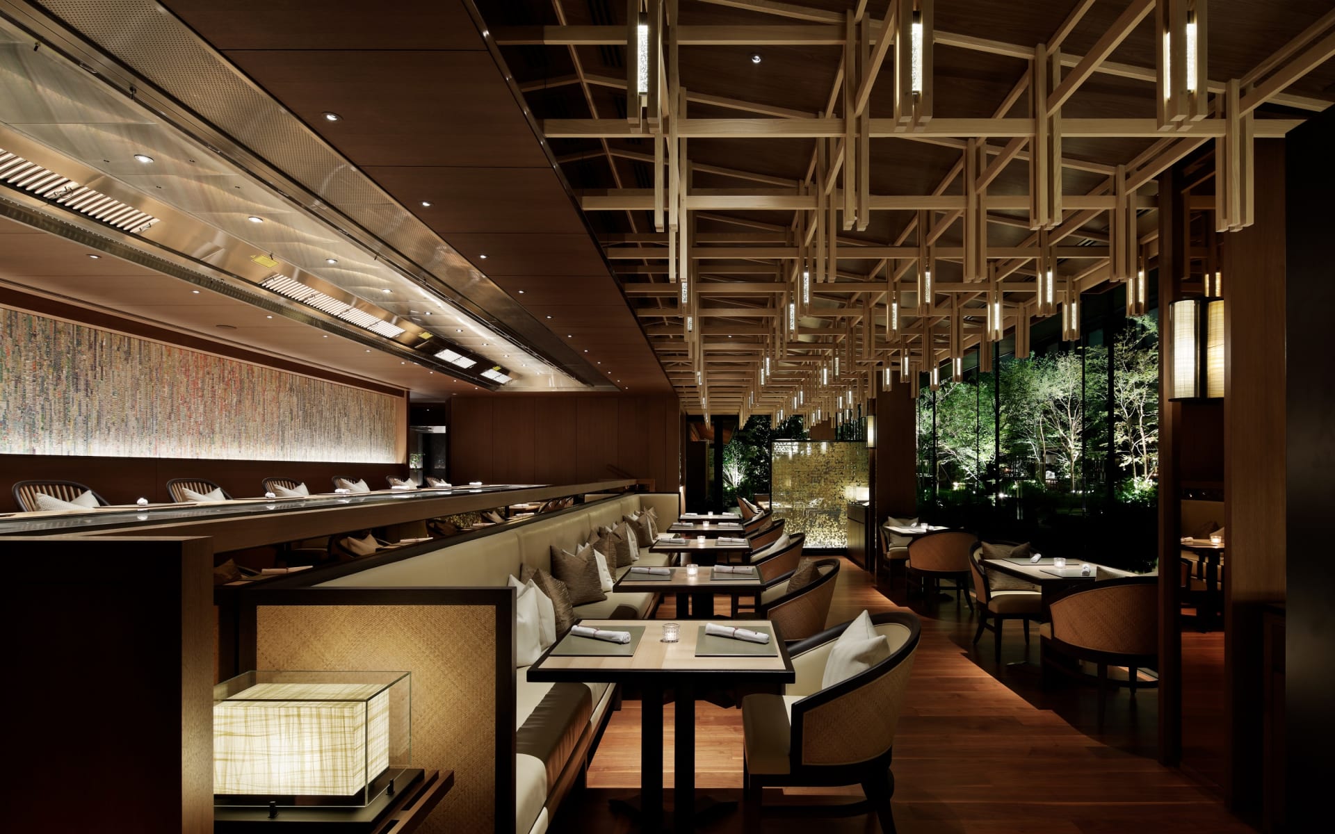 The Mitsui restaurant has a contemporary design, with tall ceilings, long rows of tables and lantern lights. 