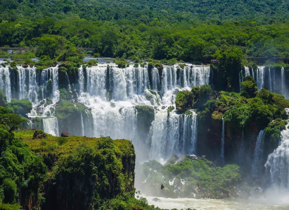 The thunderous water at Argentina's Iguazu Falls is surrounded by a jungle.
