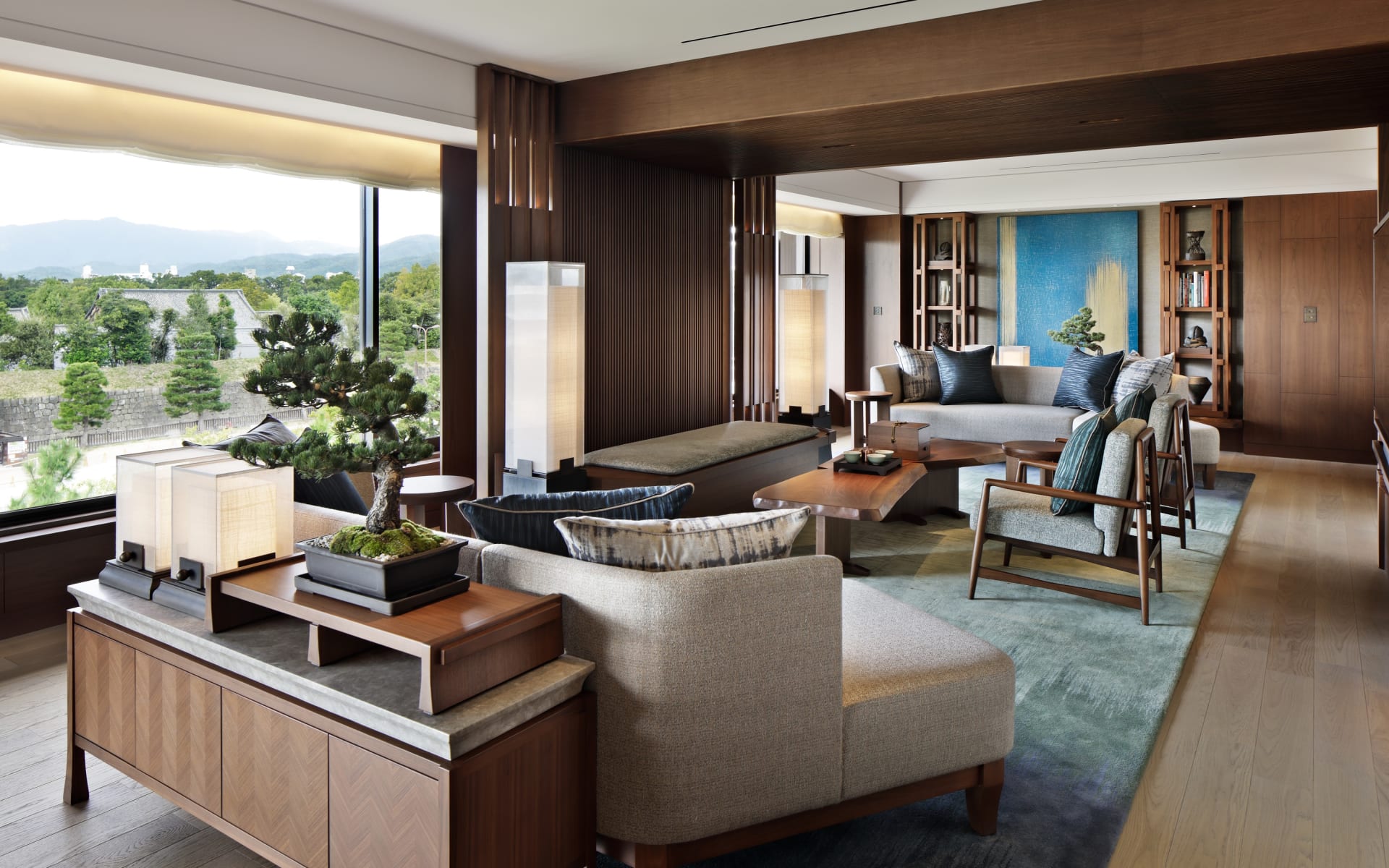 The living room in the presidential suite has floor-to-ceiling windows, lots of seating and lighting. 