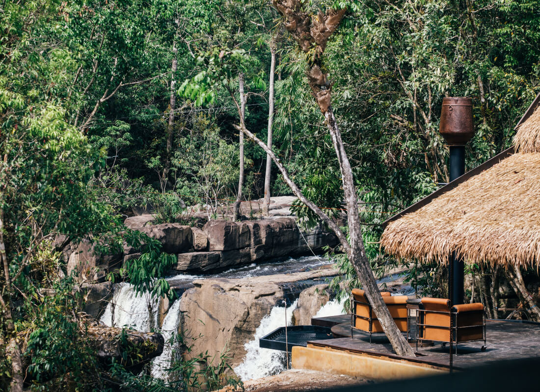 Shinta Mani Wild's Landing Zone Bar overlooks the jungle and waterfall.