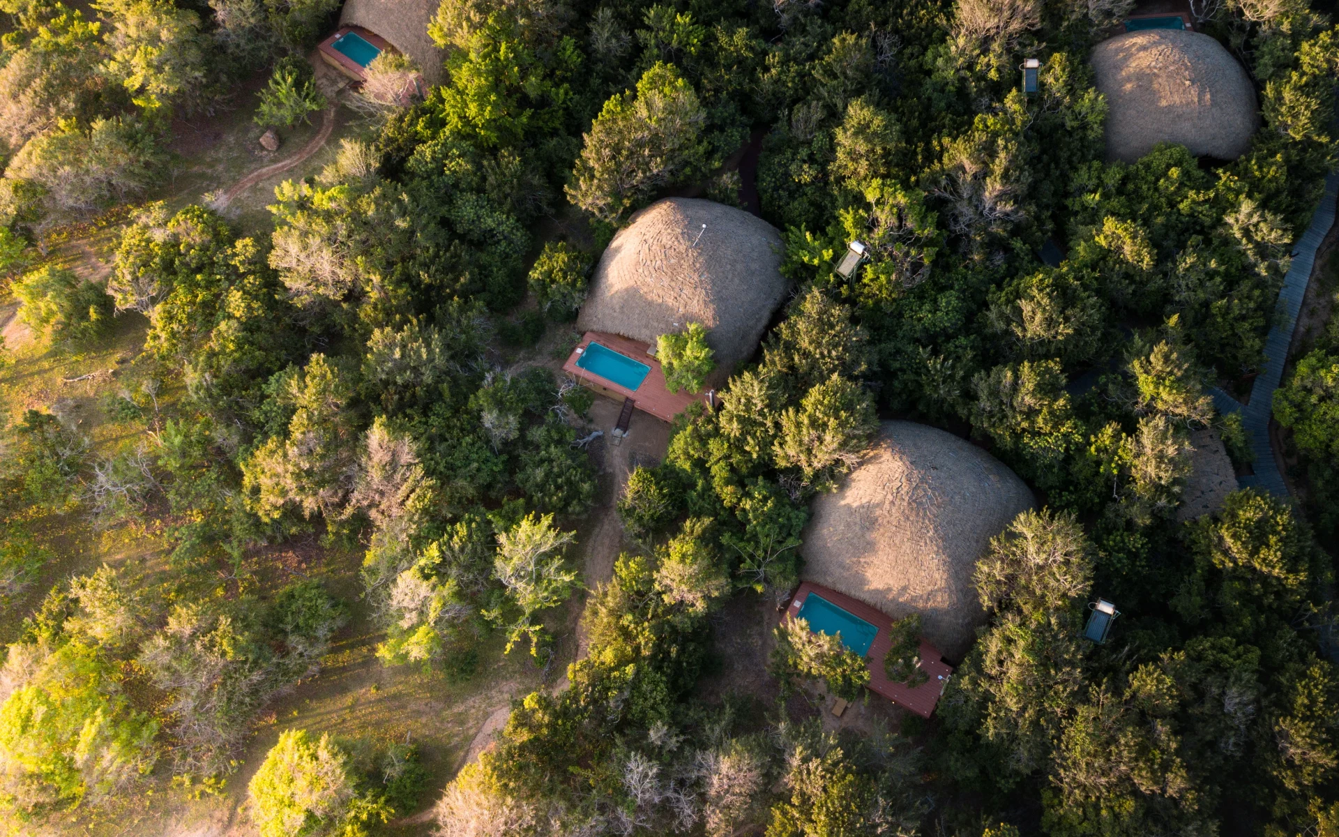 An aerial view of the thatched cottaged at Chena Huts.