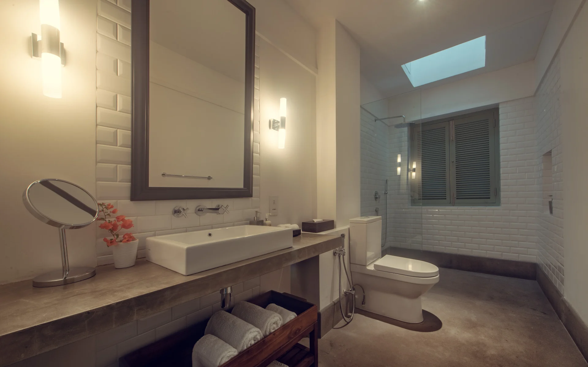One of the private bathrooms at Fort Bazaar has sleek, modern decor and a large, walk-in shower.