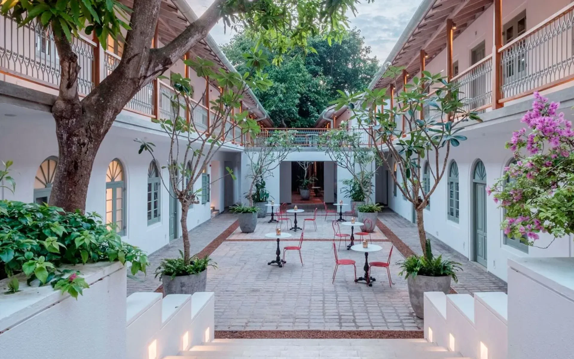The courtyard at Fort Bazaar is draped in stone paving and decorated with a range of plants
