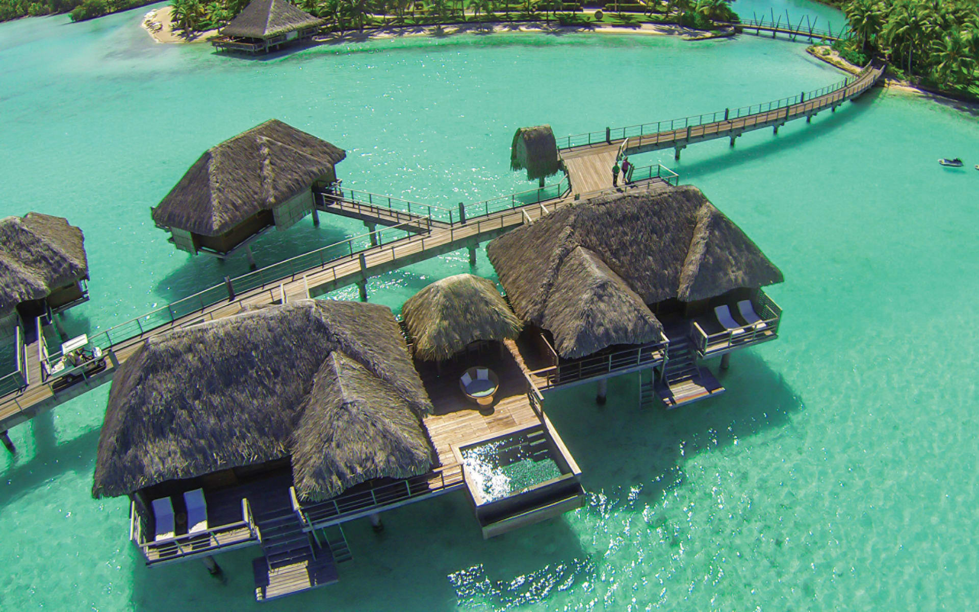 Large overwater bungalow with stunning blue waters below