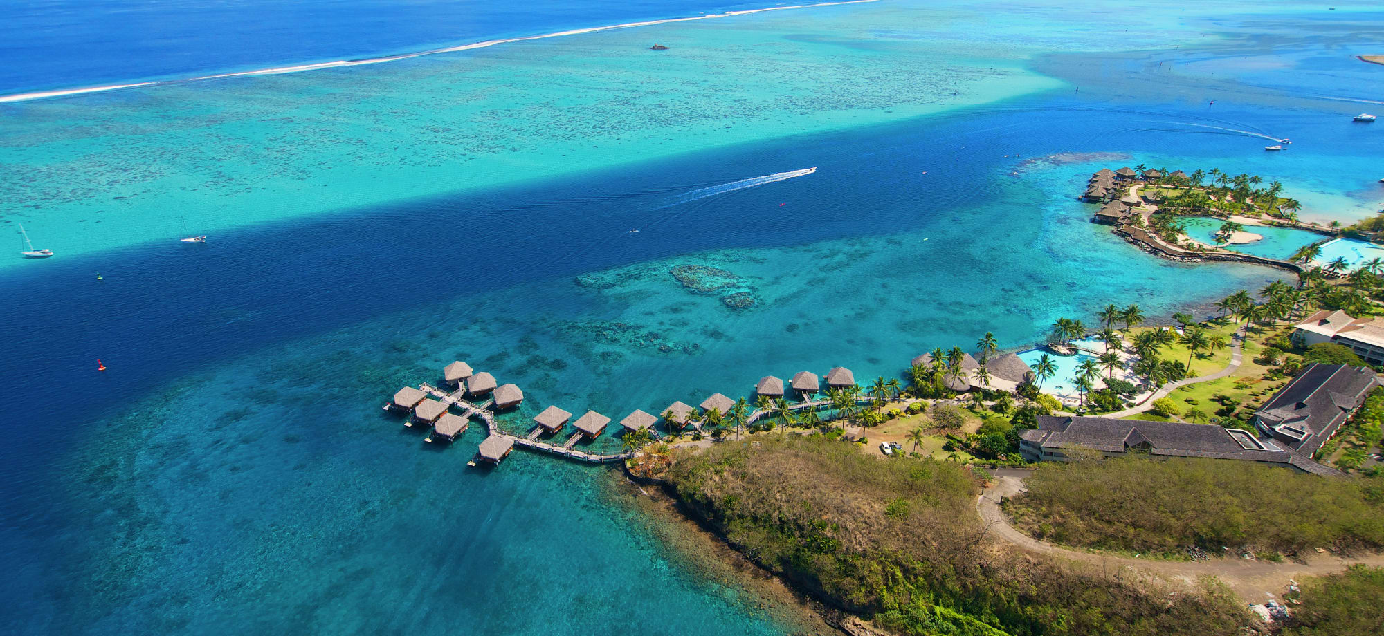 InterContinental Tahiti is an island with overwater bungalows jutting into the turquoise sea. 