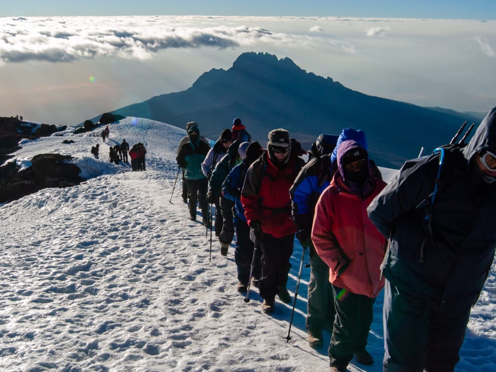 A group of people hiking Mount Kilimanjaro