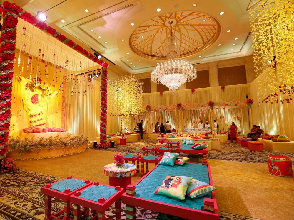 An Indian-style communal area with yellow and red decorations