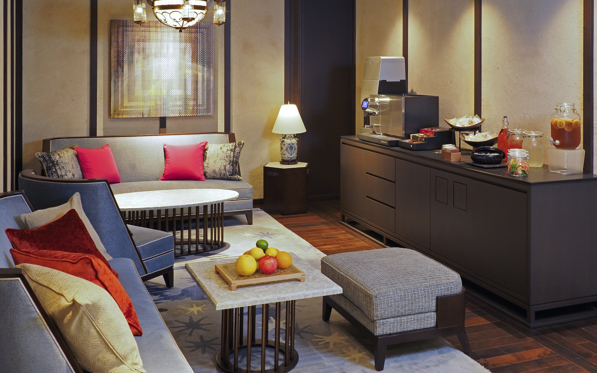 The lobby at Dhawa Yura has sofas with vibrant pillows, complementary fruit and a drinks/coffee station. 