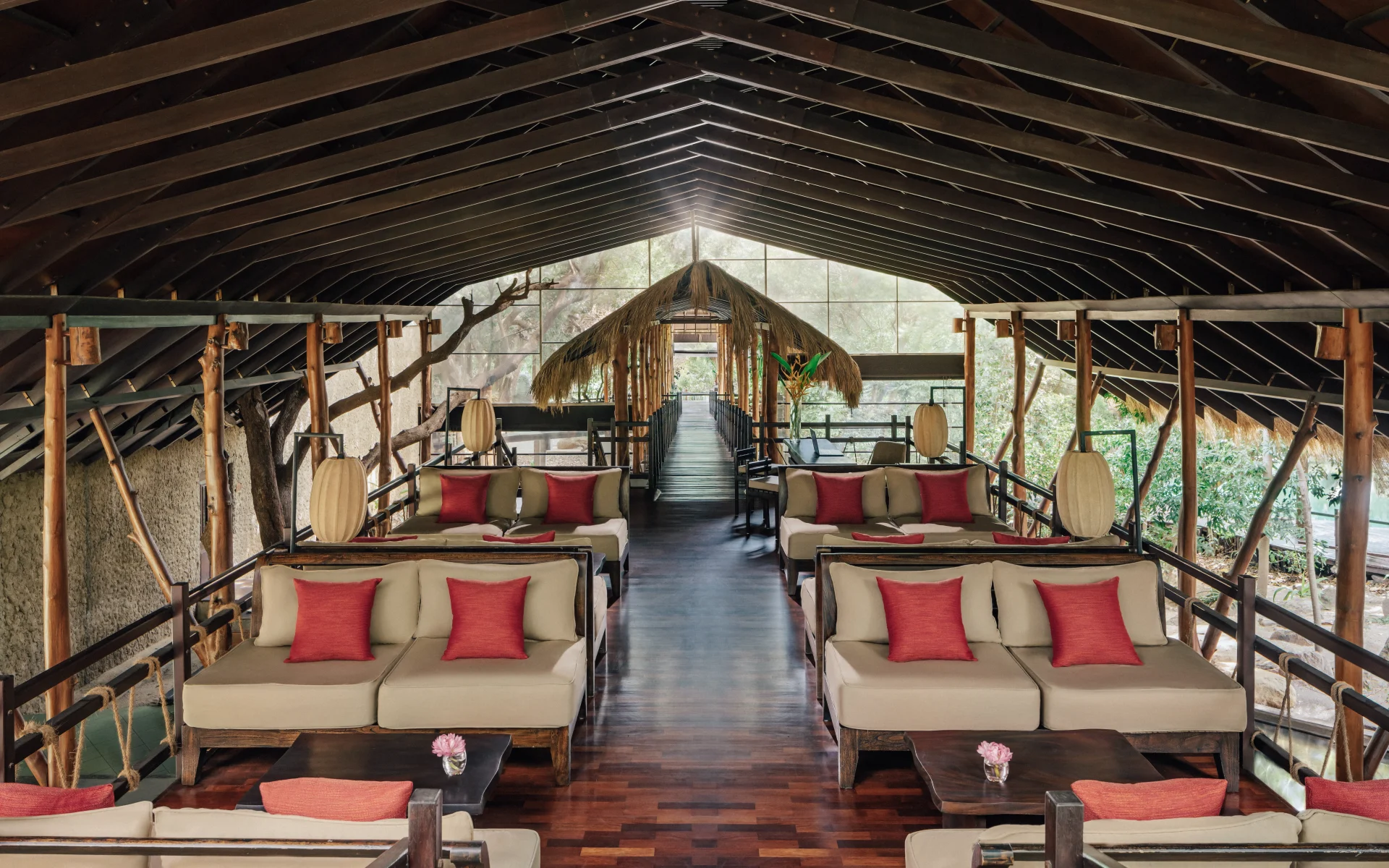 The resort lobby is comfortable and situated in a stilted hut, equipped with comfy sofas.