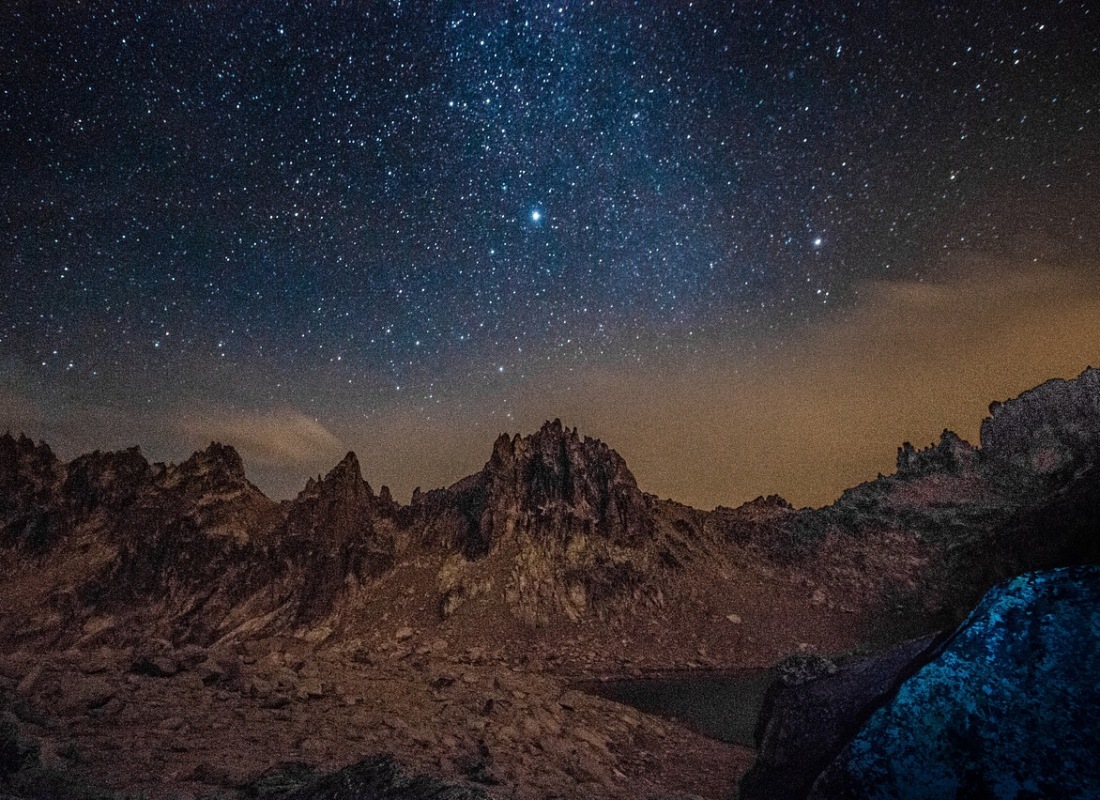 At night, the mountains in Patagonia are surrounded by stars.
