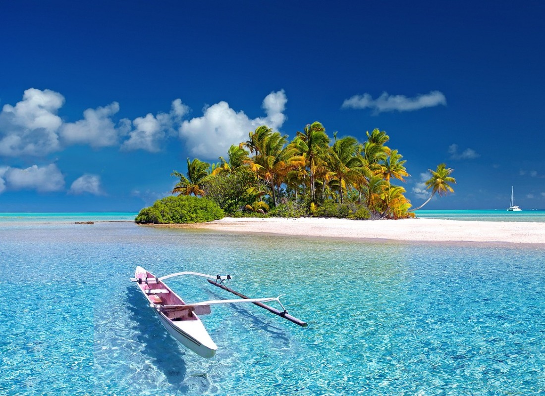 A kayak boat is perched on the edge of an island in French Polynesia. 