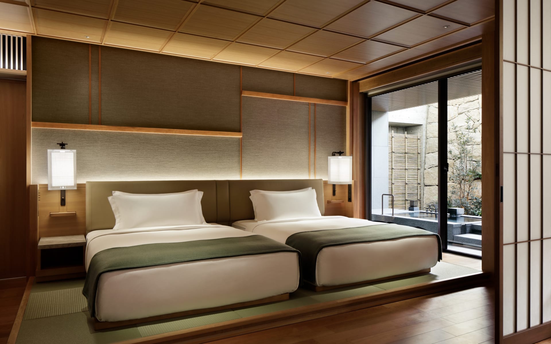 The Mitsui Onsen Suite Room has two twin beds and an outdoor area. 