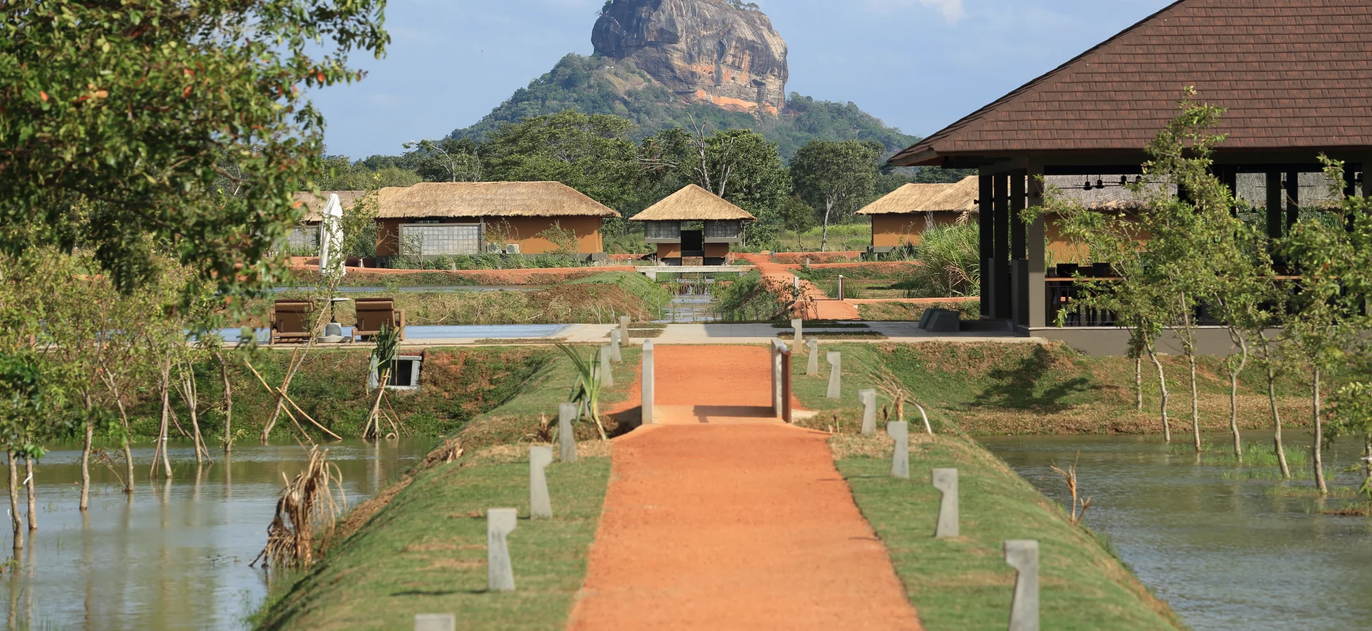 Water Garden Sigiriya sits in front of the Sigiriya Rock.