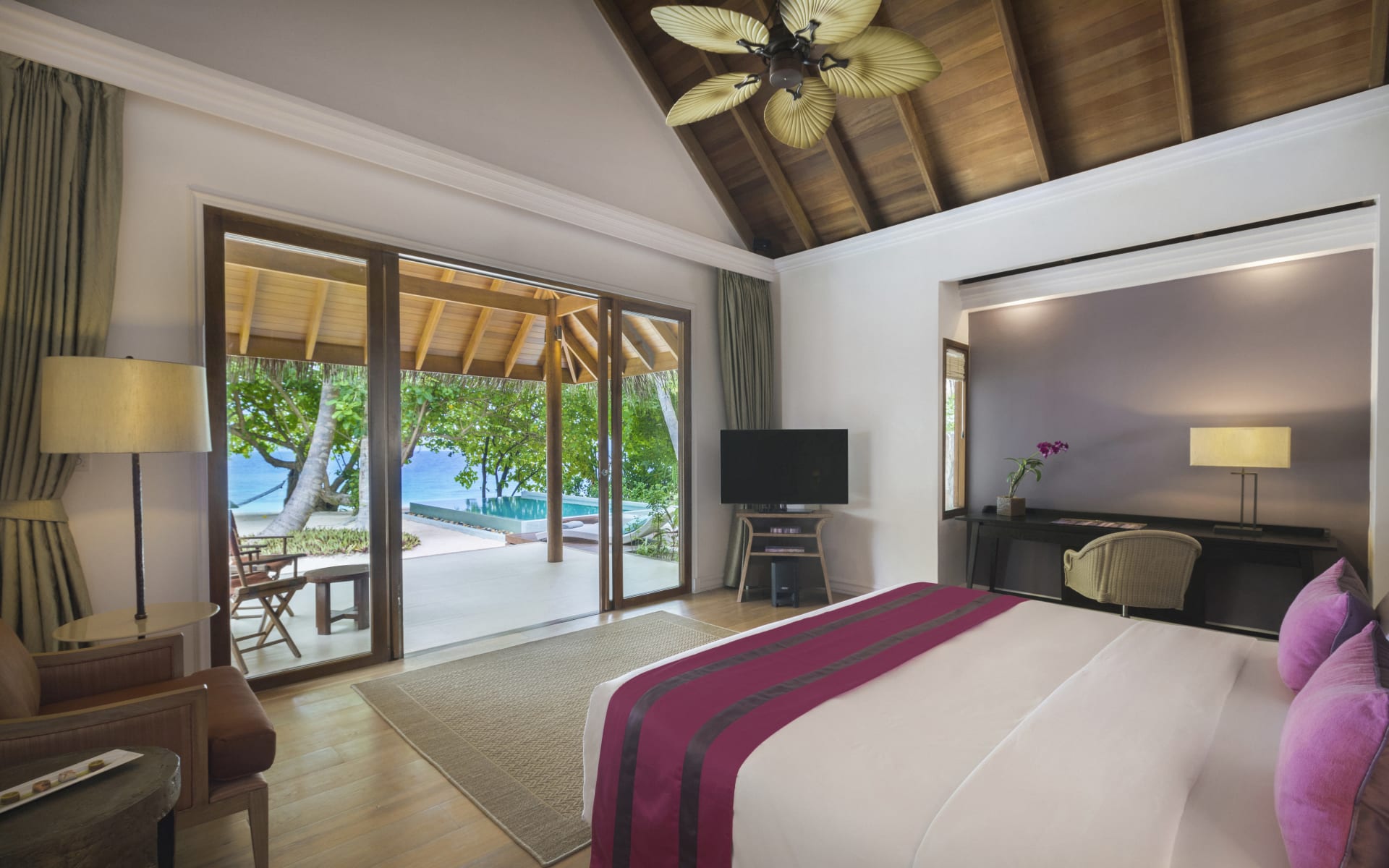 beach-villa-bedroom-view-dusit-thani-maldives_r8eskq