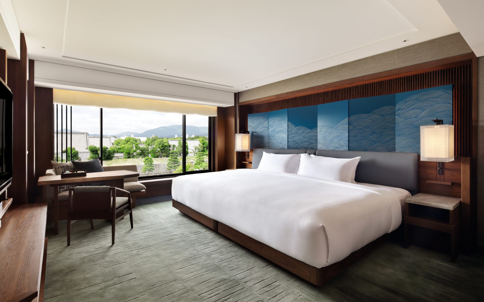 The presidential suite at The Mitsui Hotel has a king-size bed and floor-to-ceiling windows. 