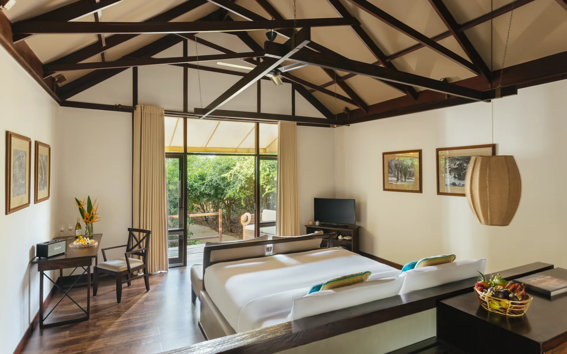 The Beach Cabins at Jungle Beach are open-spaced with wooden beams on the ceiling, decorated in a sleek and subtle style.