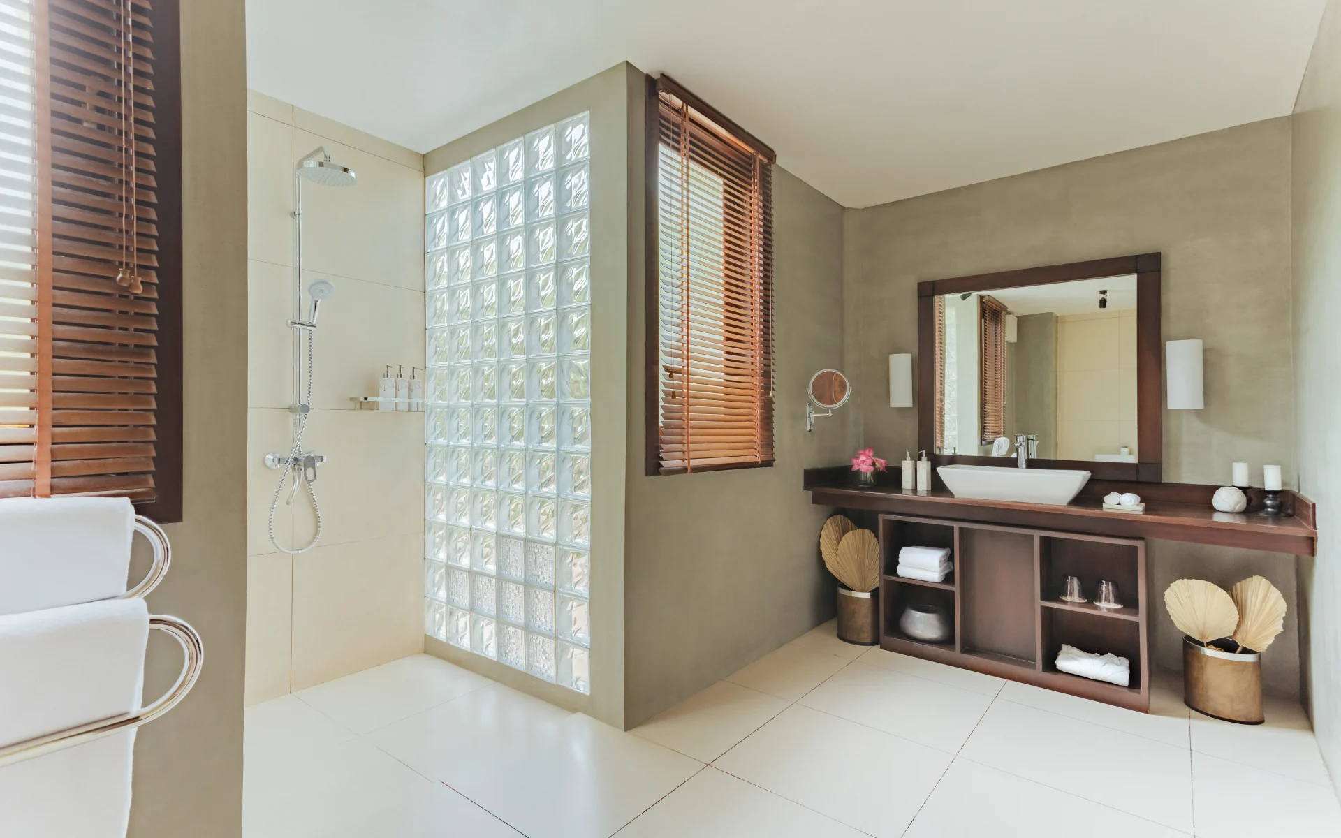 The private bathrooms are sleek with tiled floors and walk-in showers.