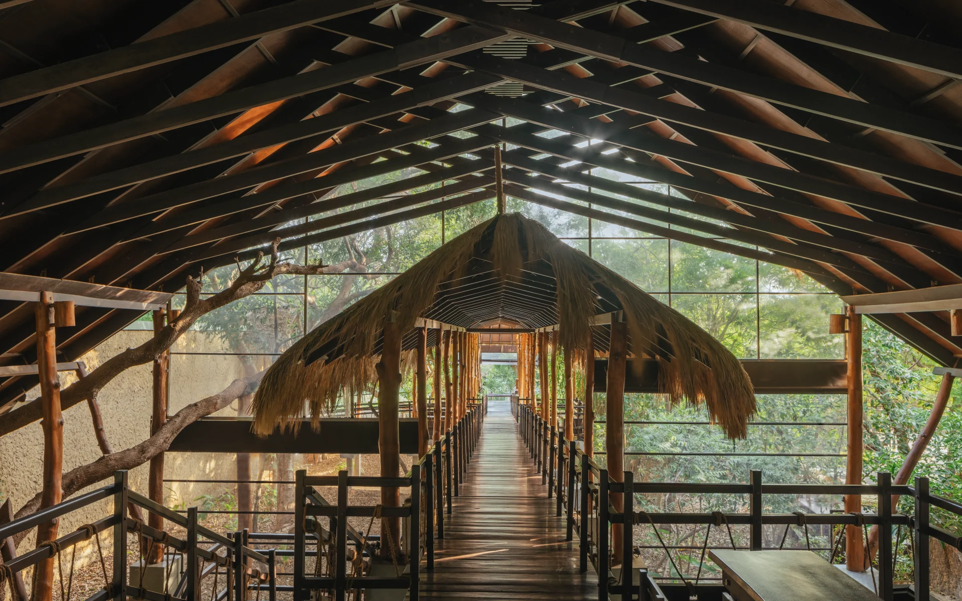 A stilted wooden bridge forms part of Jungle Beach's unique design, leding you through verdant jungle.