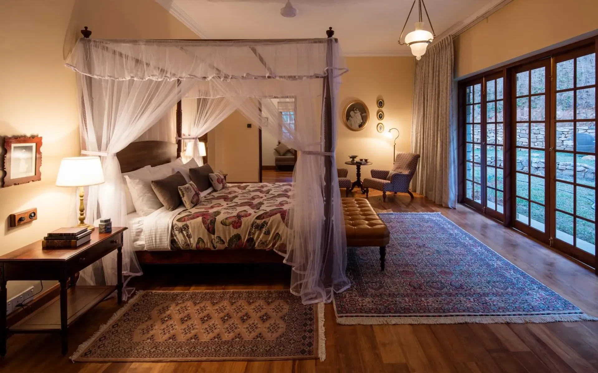 A bedroom in the Owner's Cottage of Dunkeld Bungalow, dressed in an opulent, old-fashioned design.