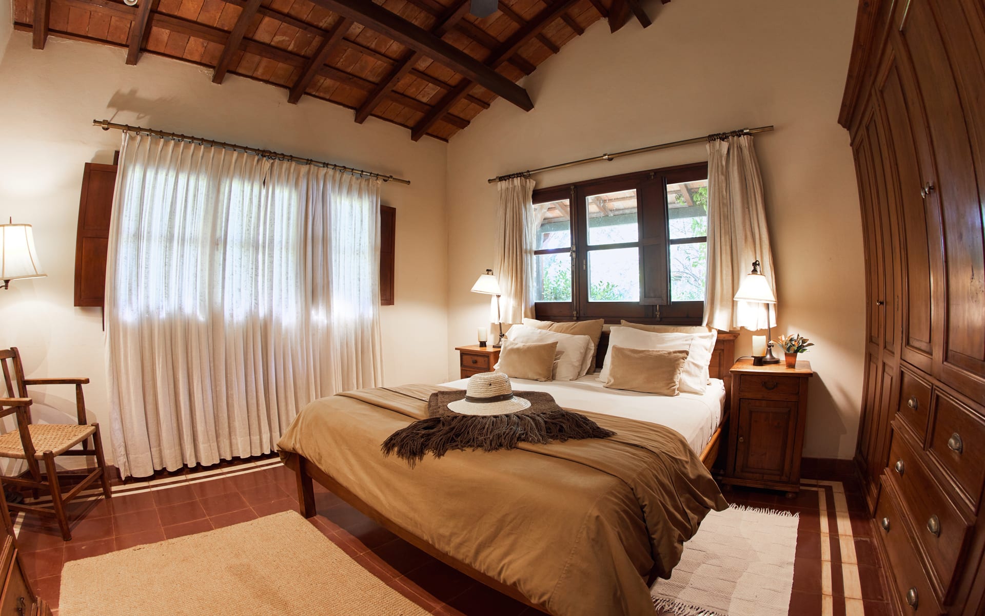 Rincon del Socorro has a down-to-earth aesthetic in its bedrooms, with a double bed surrounded by wooden furniture. 