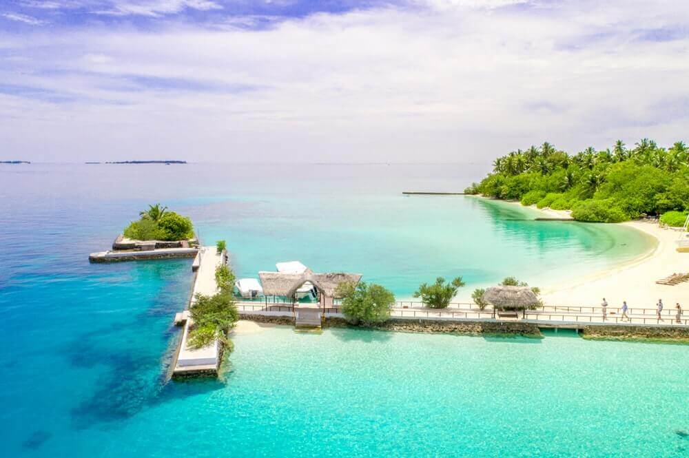 bahamas beach with dock leading into the ocean