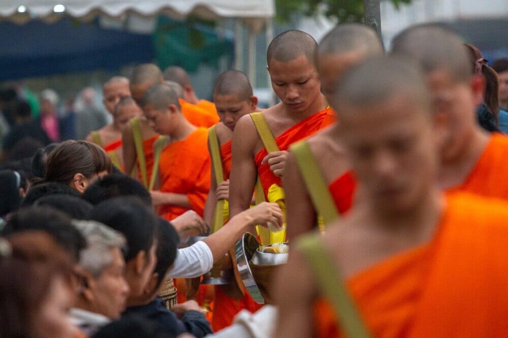 Buddhist monks receiving alms in Luang Prabang Laos