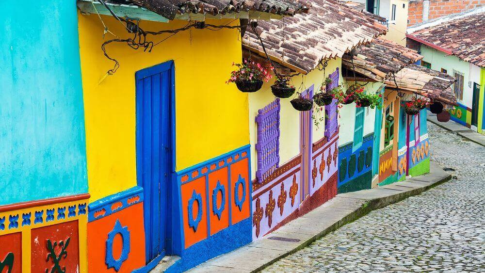 colourful buildings lining the cobblestone streets of colombia