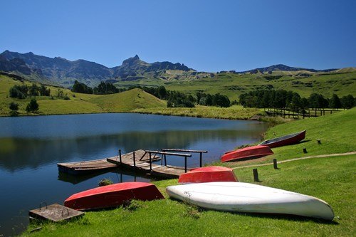 Canoes in a lake, Drakensberg Mountains