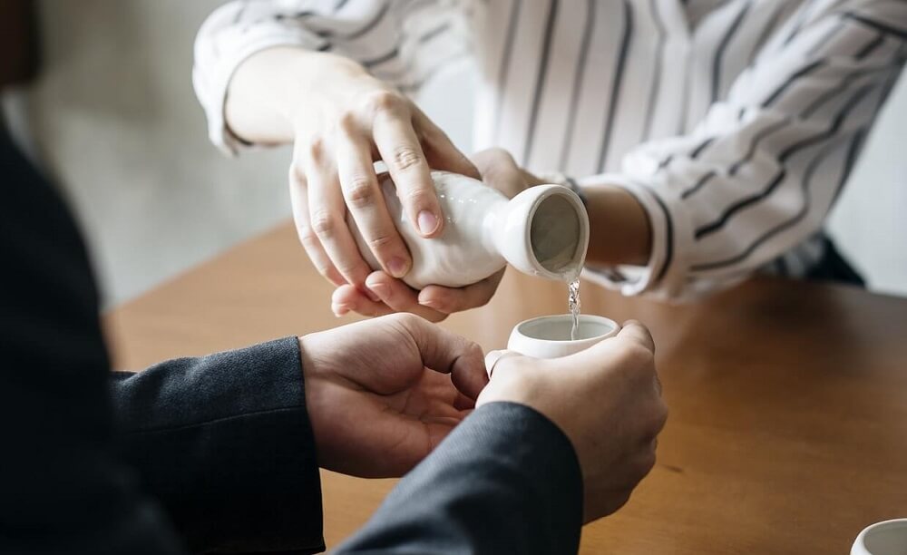 Japan Food Guide - Pouring Japanese sake