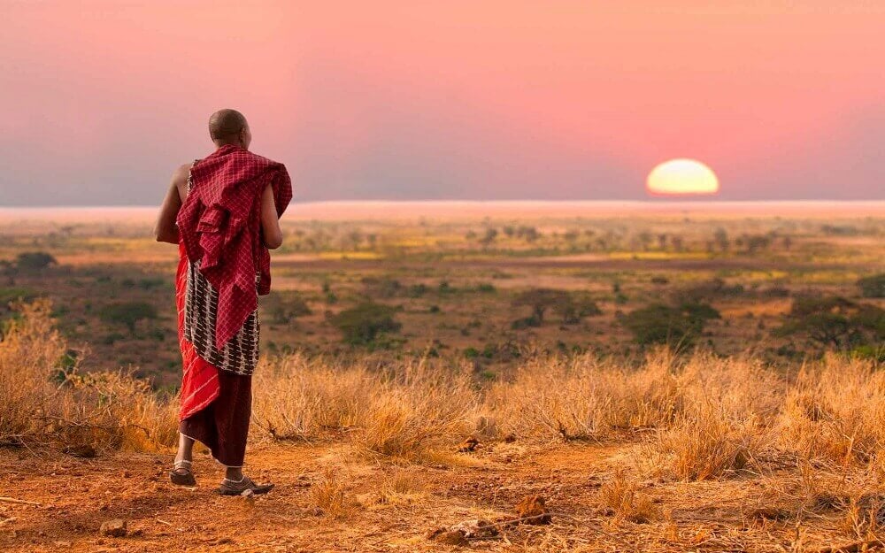 Maasai warrior at sunset on an East Africa honeymoon