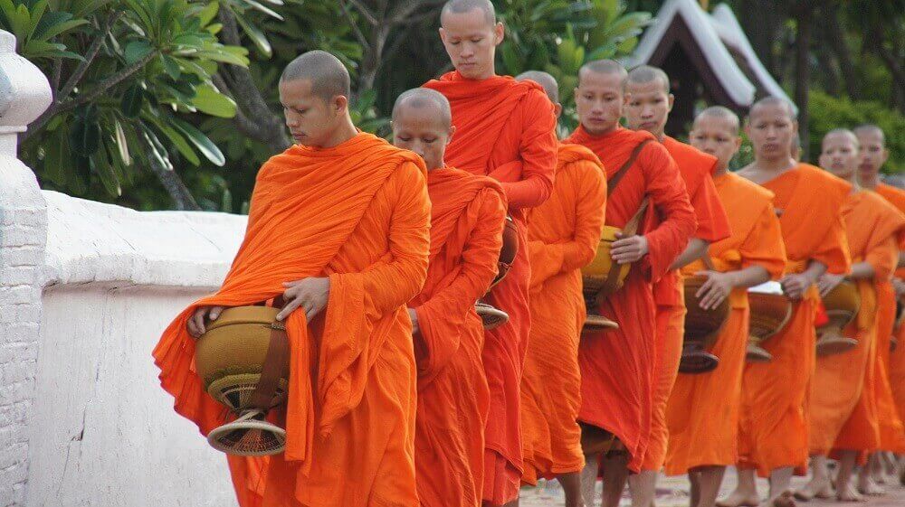 monks_orange_robes_alms_giving_ceremony_luang_prabang_laos