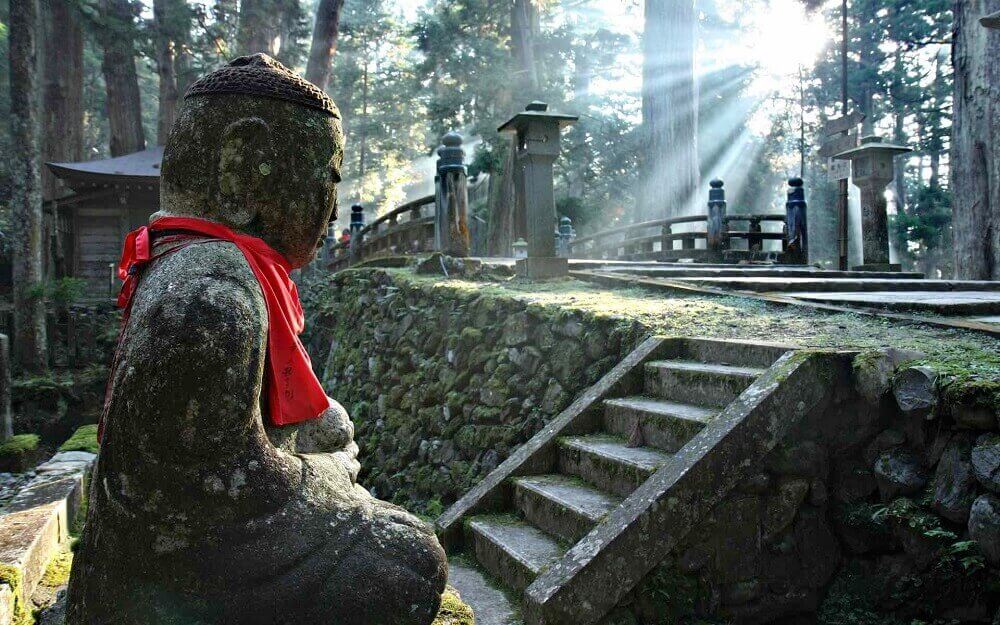 Statue and bridge at Okunoin Cemetery on Mount Koya Kansai off the beaten path in Japan