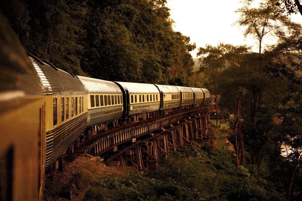 oriental express train winding through the jungle