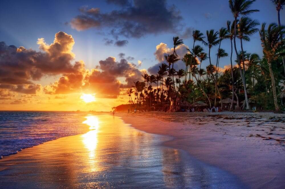 glorious sunset over the palm fringed beach in the maldives