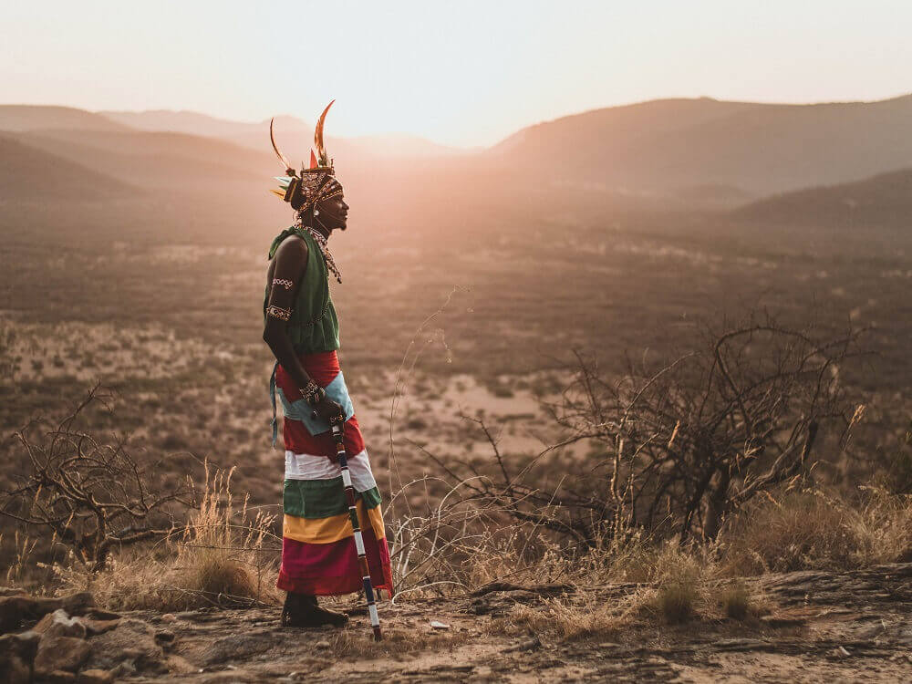 Samburu Warrior with sunset landscape in Kenya