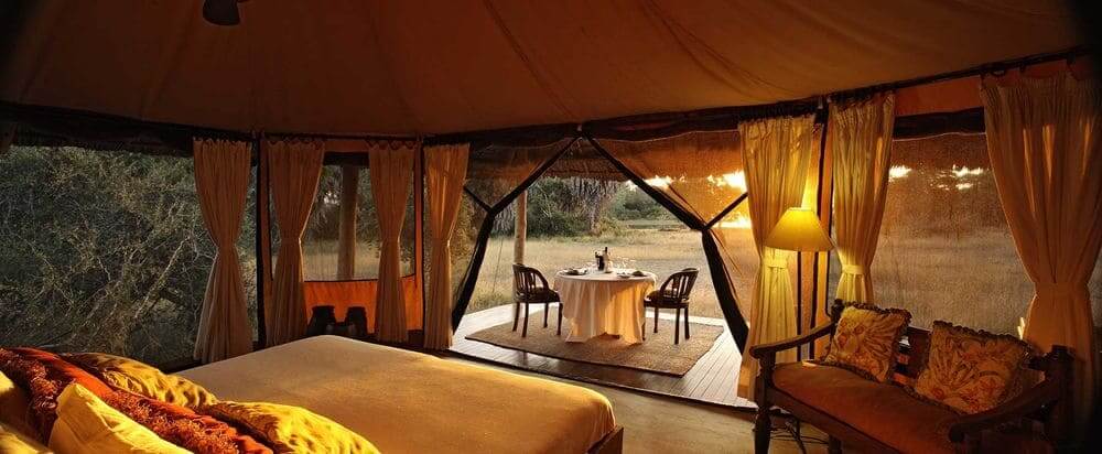 interior and view from luxury tent at siwandu camp, selous game reserve, tanzania