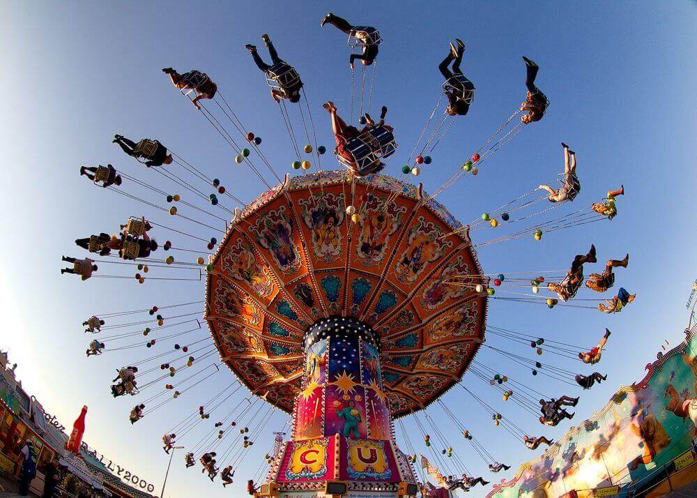 people swinging in the air on a carnival ride