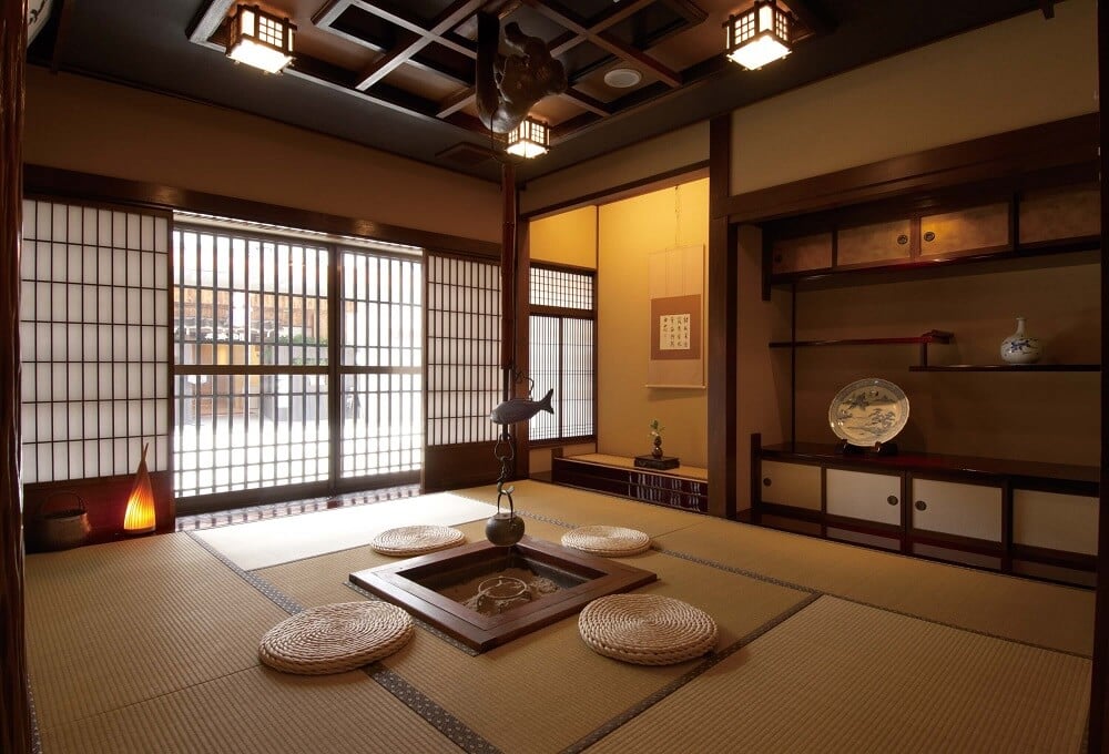 Traditional Japanese ryokan room with tatami mats and paper screen doors