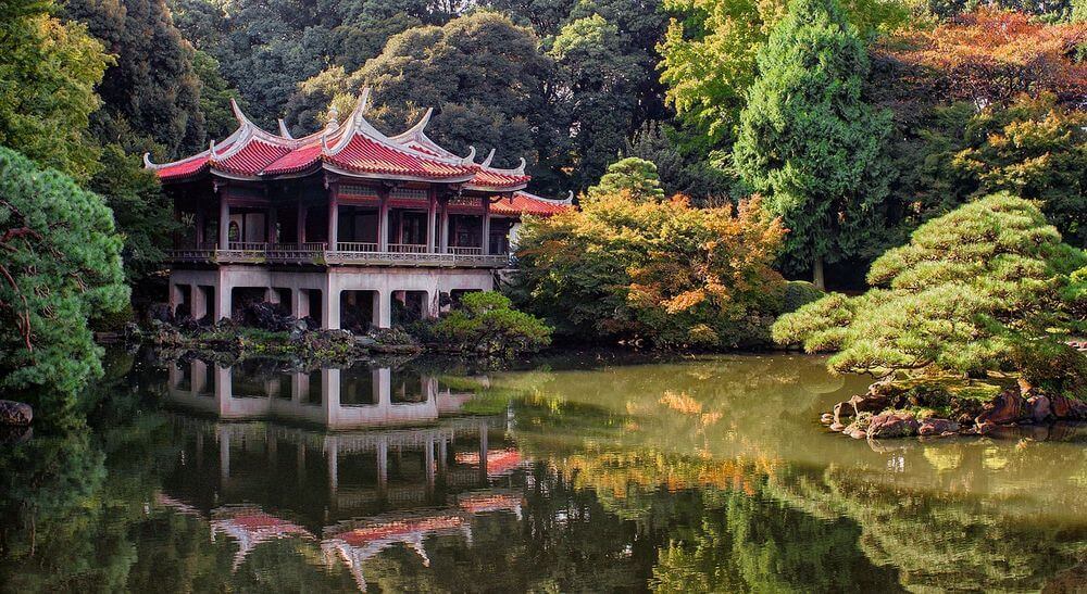 japanese temple overlooking a serene garden and pond in Japan