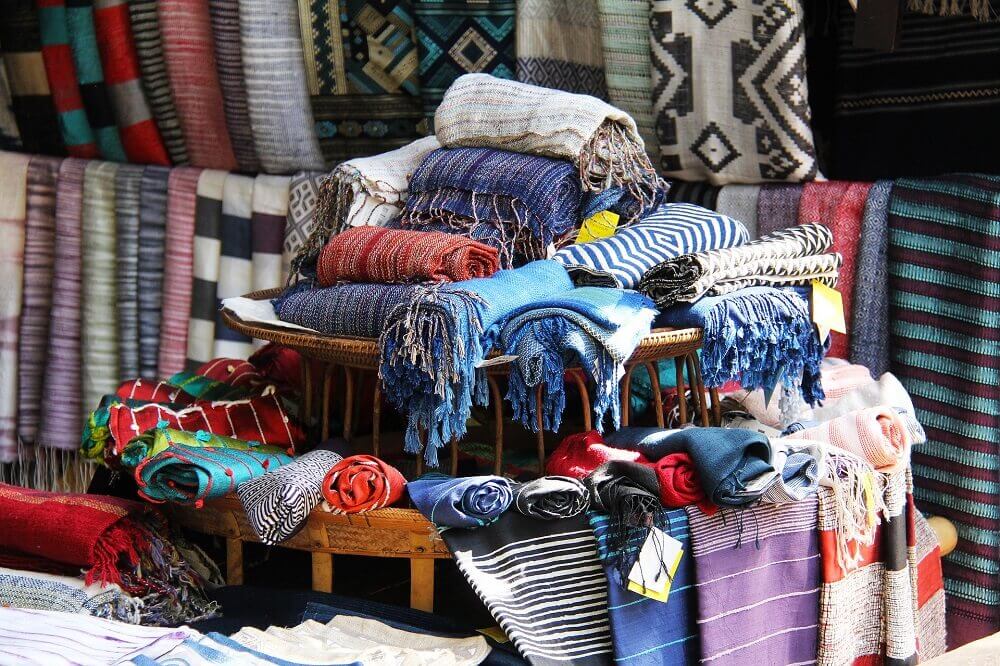 Traditional handicrafts like scarves at a market in Luang Prabang Laos