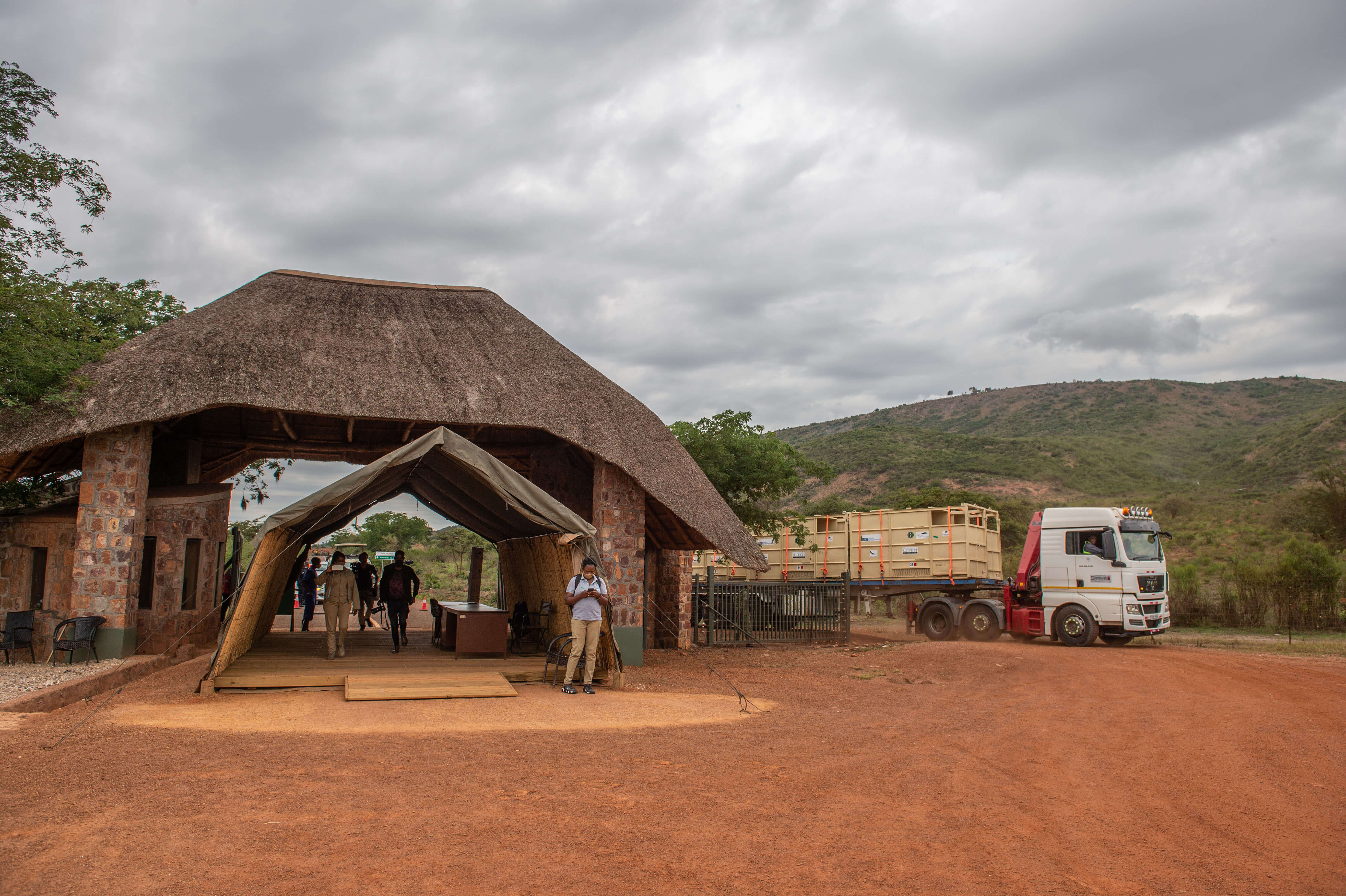 The trucks carrying rhinos arrive to the entrance gate of Akagera National Park
