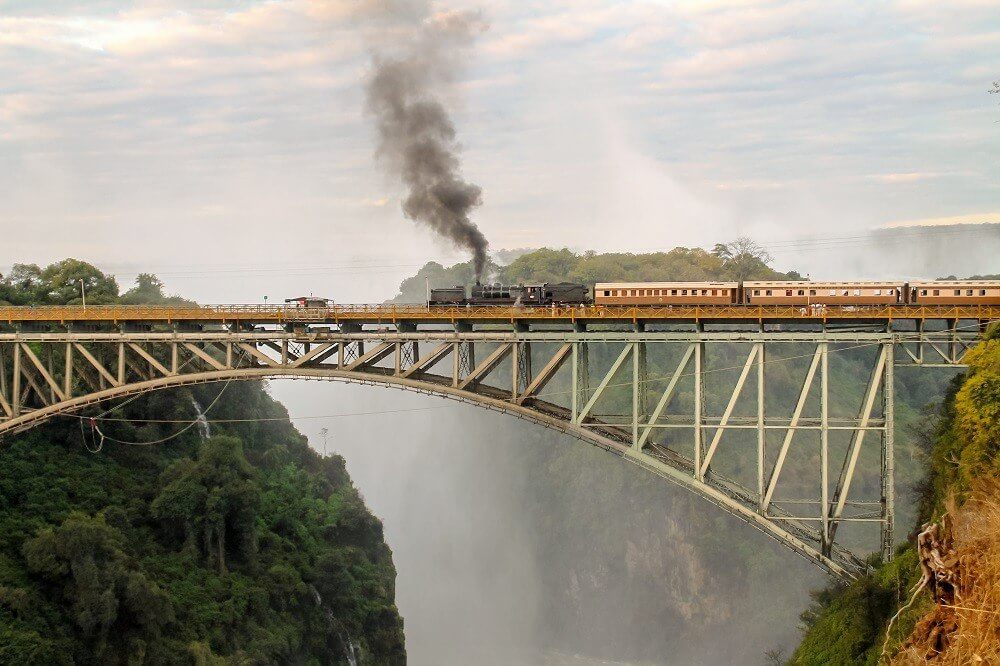 Train along Victoria Falls Bridge