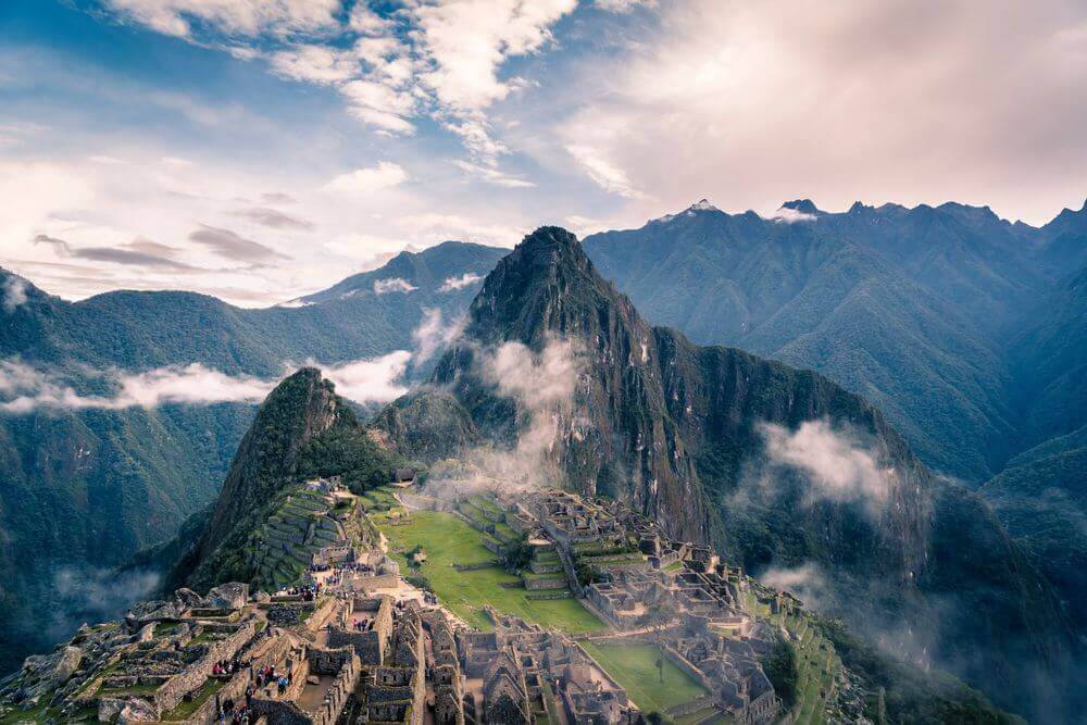 machu picchu rising through the misty clouds