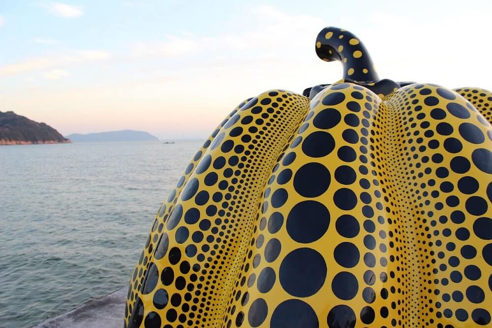 Yayoi Kusama yellow pumpkin on Naoshima Island off the beaten path in Japan